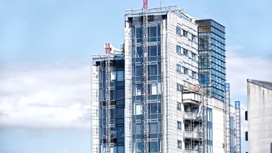 An architectual image of a modern apartment block