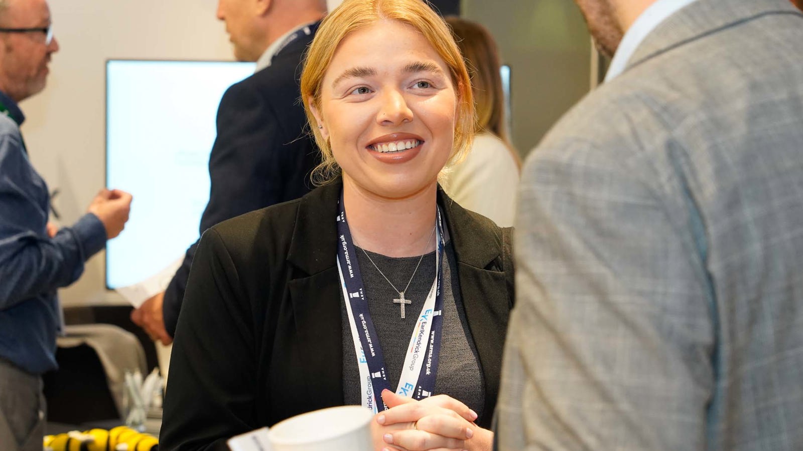 A woman talking to a man at a property managers industry event