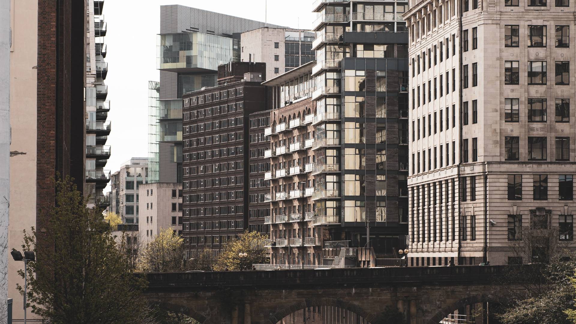 Apartments and offices sitting next to a body of water